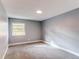 Bright bedroom with gray walls, carpet and a window at 2790 S Wheeling Way, Aurora, CO 80014