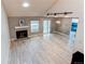 Living area with vaulted ceiling, fireplace and hardwood floors at 2790 S Wheeling Way, Aurora, CO 80014