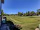 Scenic view of a lush green golf course with trees and homes in the background at 2790 S Wheeling Way, Aurora, CO 80014