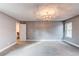 Well-lit bedroom featuring gray walls and carpeting at 2790 S Wheeling Way, Aurora, CO 80014