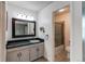 Updated bathroom with gray vanity, a shower/tub combo, and new flooring at 2790 S Wheeling Way, Aurora, CO 80014