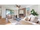 Bright living room with fireplace and large windows at 2479 Alkire St, Golden, CO 80401