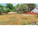 Large backyard with fenced perimeter and mature trees at 2479 Alkire St, Golden, CO 80401