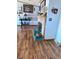 Living room with hardwood floors and a brick fireplace at 16859 County Road 4, Brighton, CO 80603