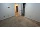 Spacious bedroom with a large closet and access to hallway at 11132 E Harvard Dr, Aurora, CO 80014