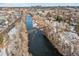 Aerial view of river, bridge, and surrounding neighborhood at 2317 S Galapago St, Denver, CO 80223