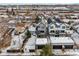Two modern townhomes with attached garages and snowy landscape at 2317 S Galapago St, Denver, CO 80223