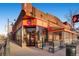 A charming corner shop with colorful signage and outdoor seating at 740 N Pearl St # 503, Denver, CO 80203