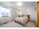 Cozy bedroom featuring a double bed and neutral decor at 1227 Loch Ness Ave, Broomfield, CO 80020