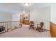 Spacious upper hallway with two rocking chairs at 1227 Loch Ness Ave, Broomfield, CO 80020