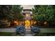 Evening view of home's exterior, showcasing architectural details and landscaping at 235 Eudora St, Denver, CO 80220