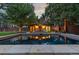 Inviting backyard pool with surrounding patio and seating at 235 Eudora St, Denver, CO 80220