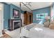 Spacious bedroom with a fireplace, built-in closet, and calming blue walls at 235 Eudora St, Denver, CO 80220