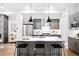 Modern kitchen with island, stainless steel appliances, and wood cabinets at 4044 W 16Th Ave, Denver, CO 80204