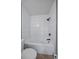 Simple bathroom with a shower/tub combo and white tile at 9240 W 49Th Ave # 305, Wheat Ridge, CO 80033