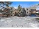 Exterior view of building with snowy yard and balconies at 9240 W 49Th Ave # 305, Wheat Ridge, CO 80033