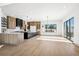 Modern kitchen with light wood cabinets, large island, and stainless steel appliances at 7916 Forest Keep Cir, Parker, CO 80134