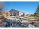 Cozy backyard patio with fire pit and seating area at 3153 Eagle Claw Pl, Castle Rock, CO 80108