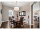 Formal dining room with dark wood table and six chairs at 3153 Eagle Claw Pl, Castle Rock, CO 80108