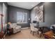 Modern home office features a glass desk and comfortable armchair at 3153 Eagle Claw Pl, Castle Rock, CO 80108