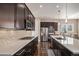 Modern kitchen with stainless steel appliances and dark cabinetry at 3153 Eagle Claw Pl, Castle Rock, CO 80108