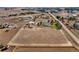 Aerial view of a house and surrounding farm land at 16621 Horizon Dr, Brighton, CO 80601