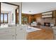 Kitchen with white cabinets and view to living room and fireplace at 3215 Lafayette Dr, Boulder, CO 80305