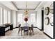 Elegant dining room with modern chandelier and hardwood floors at 3276 S Cherry St, Denver, CO 80222