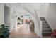 Modern staircase with light gray carpeting and white railings at 8447 W Dakota Ave # C, Lakewood, CO 80226