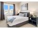 Comfortable bedroom with a king-size bed and plenty of natural light at 1481 Harebell St, Berthoud, CO 80513
