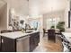 Open concept kitchen with island and breakfast bar at 1481 Harebell St, Berthoud, CO 80513