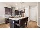 Modern kitchen with island and stainless steel appliances at 1481 Harebell St, Berthoud, CO 80513