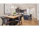 Kitchen and dining area with an island and modern finishes at 1481 Harebell St, Berthoud, CO 80513