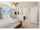 Spacious bedroom with large windows and ensuite bathroom at 1481 Harebell St, Berthoud, CO 80513