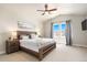 Main bedroom with a ceiling fan and large windows at 1481 Harebell St, Berthoud, CO 80513