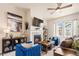 Bright living room with fireplace and comfortable seating at 1481 Harebell St, Berthoud, CO 80513