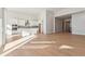 Open concept kitchen and living area with hardwood floors and abundant natural light at 3813 Freestone Pt, Castle Rock, CO 80108
