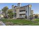 Two-story building with stone and siding exterior, balconies, and landscaping at 8853 Colorado Blvd # A-106, Thornton, CO 80229