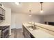 Kitchen with stainless steel appliances, light grey cabinets, and a breakfast bar at 8853 Colorado Blvd # A-106, Thornton, CO 80229