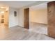 Bright bedroom with wood-look floors and access to bathroom at 8853 Colorado Blvd # A-106, Thornton, CO 80229