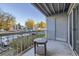 Private patio with table and view of parking lot at 8853 Colorado Blvd # A-106, Thornton, CO 80229