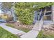 Building exterior with stairs and landscaping at 8853 Colorado Blvd # A-106, Thornton, CO 80229