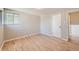 Well-lit bedroom, featuring hardwood floors and a closet at 3055 Carson St, Aurora, CO 80011