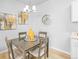 Bright dining room with a square table and four chairs, tasteful wall art, and a chandelier at 10805 Twenty Mile Rd # 307, Parker, CO 80134