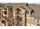Attractive three-story building with balconies and stone accents at 10805 Twenty Mile Rd # 307, Parker, CO 80134