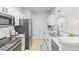 Well-equipped kitchen featuring white cabinetry at 10805 Twenty Mile Rd # 307, Parker, CO 80134