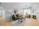 Spacious living room with fireplace and hardwood floors at 10805 Twenty Mile Rd # 307, Parker, CO 80134