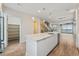 Modern kitchen with island, stainless steel appliances, and ample storage at 163 S Harrison St, Denver, CO 80209