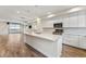 Open kitchen with island and granite countertops at 163 S Harrison St, Denver, CO 80209