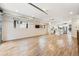 Open living area with hardwood floors and kitchen views at 163 S Harrison St, Denver, CO 80209